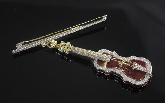 An 18ct gold, enamel and diamond set pendant modelled as a violin, suspended from a gold diamond set bar brooch, violin 67mm.